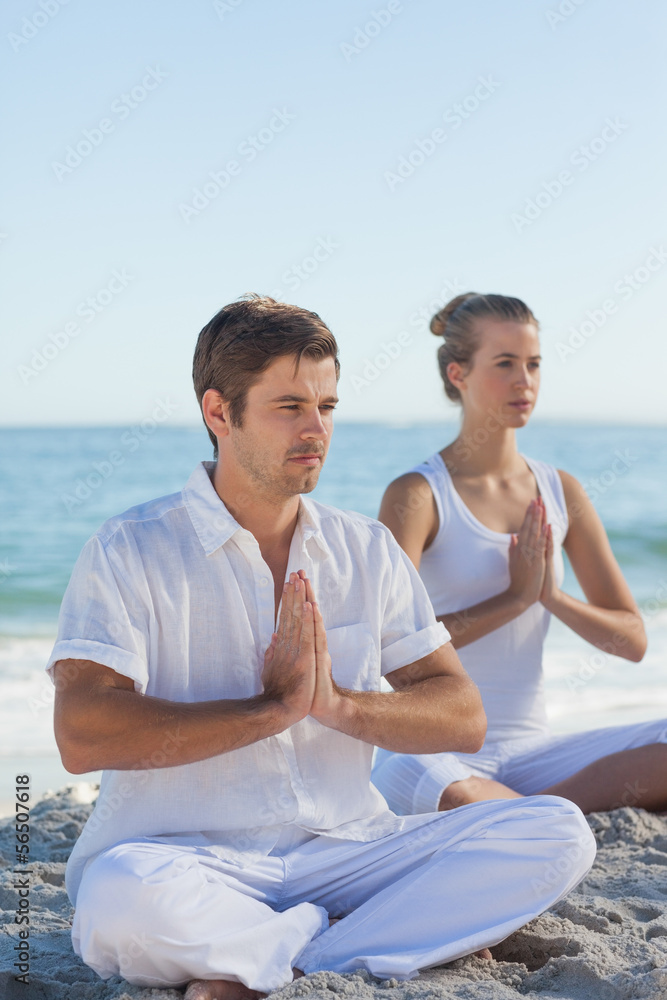 Fototapeta premium Man and woman practicing yoga