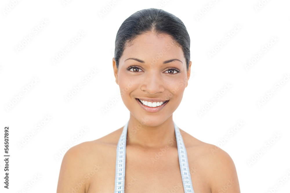 Cheerful black haired model wearing measuring tape Cheerful black haired model wearing measuring tape