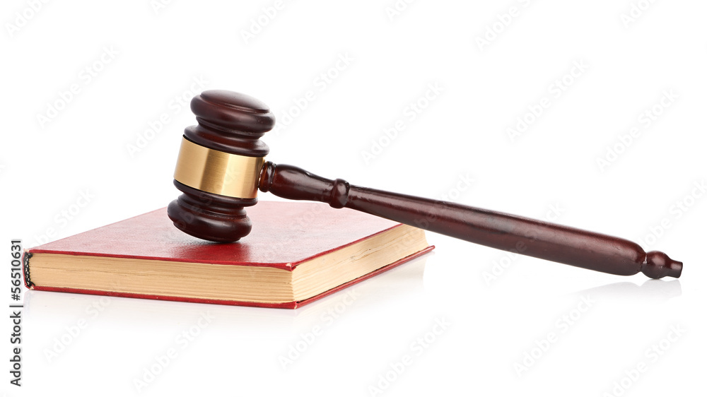 Judge's gavel on red legal book