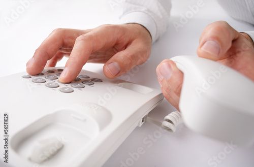 Man making a telephone call on a landline