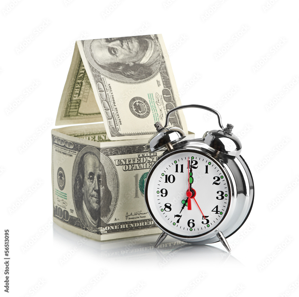 house made of dollars and alarm clock. house made of dollars and alarm clock.