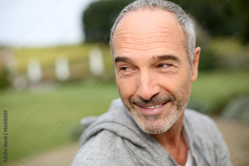 Cheerful casual senior man in countryside Cheerful casual senior man in countryside