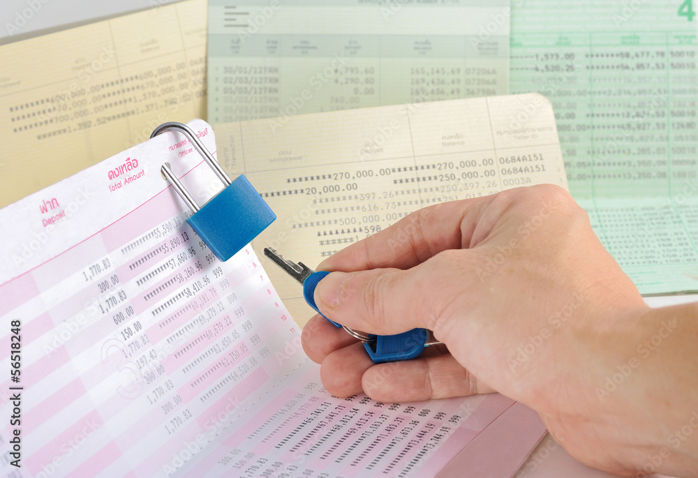 Obraz premium passbook was locked padlock with key;concept of unsecurity;