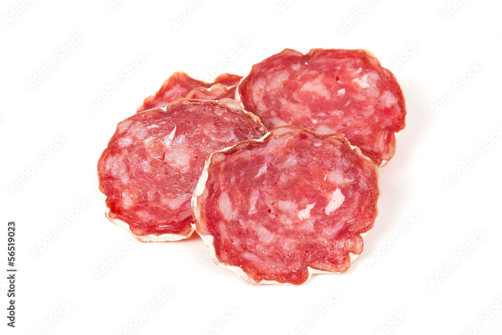 pile of red salami, on a white pile of red salami, on a white