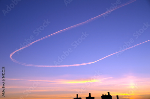 Jet vapour trail against sunset © Pitamaha