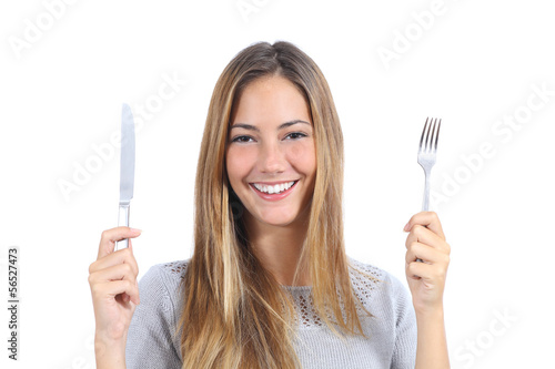 Beautiful woman holding a fork and a table knife