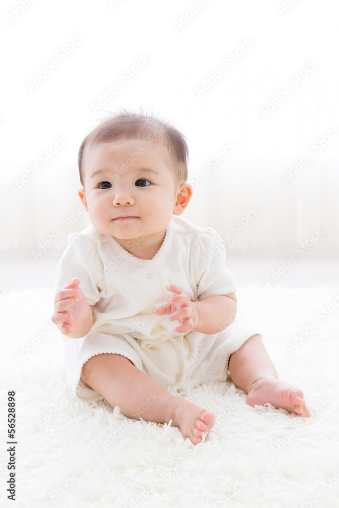 asian baby relaxing on the carpet asian baby relaxing on the carpet