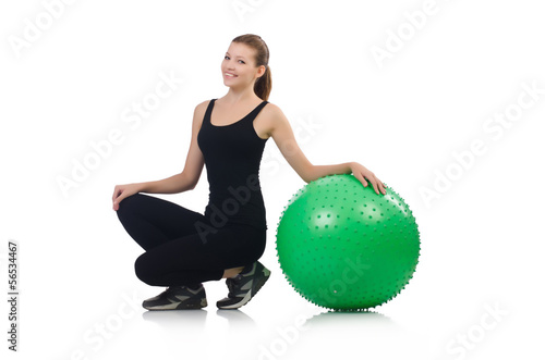 Young woman with ball exercising on whitee photo