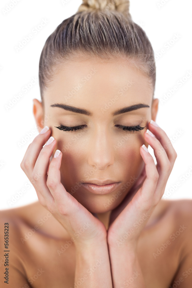 Concentrated woman holding her head and closing her eyes Concentrated woman holding her head and closing her eyes