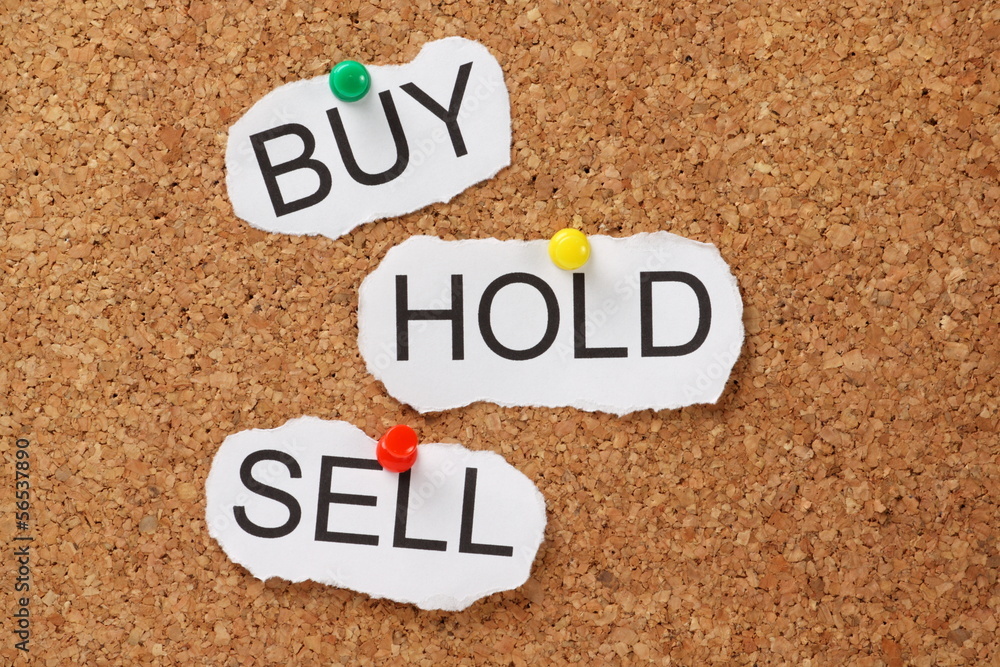 Buy Hold or Sell on a cork notice board Buy Hold or Sell on a cork notice board