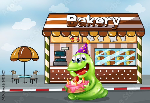 A monster with a cake near the bakery