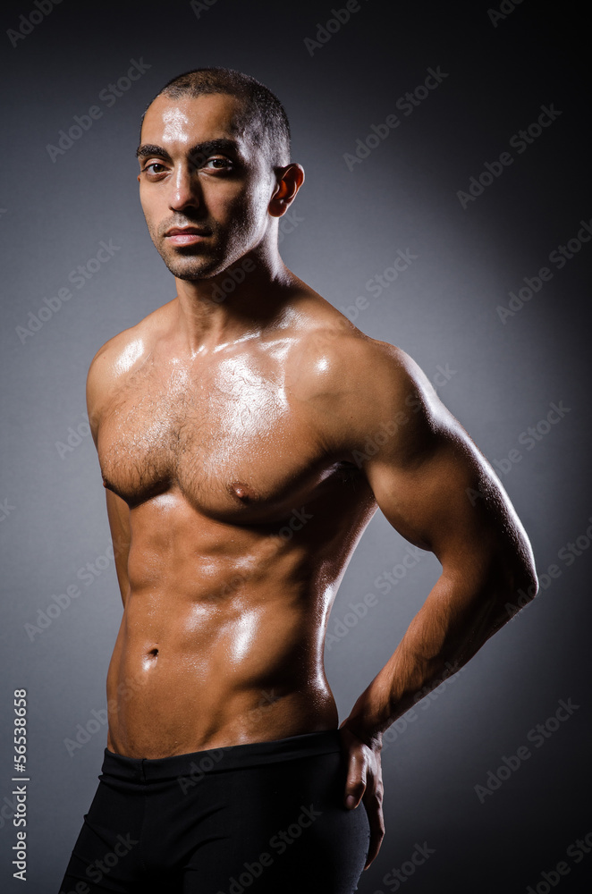 Ripped young man in bodybuilding concept Ripped young man in bodybuilding concept