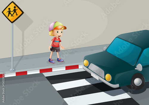 A young boy at the pedestrian lane