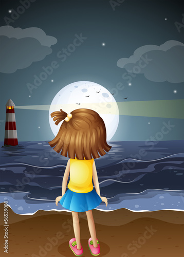 A small girl watching the fullmoon at the beach