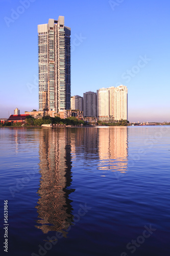 Condo along the Chao Phraya water reflections evening