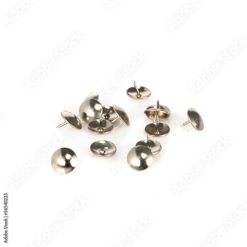 Steel pushpin isolated over white background.