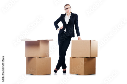 Businesswoman with boxes isolated on white © Elnur