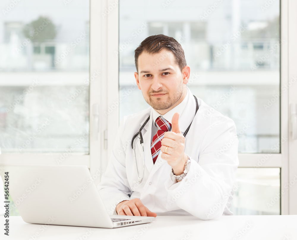 Young male doctor working in his studio