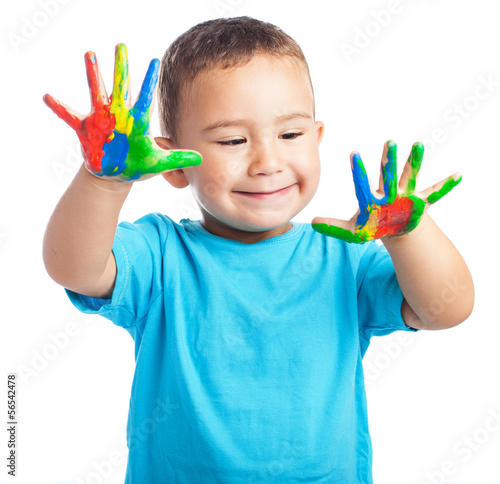 Child with painted hands on a white background