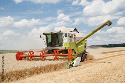 Combine working on a wheat field