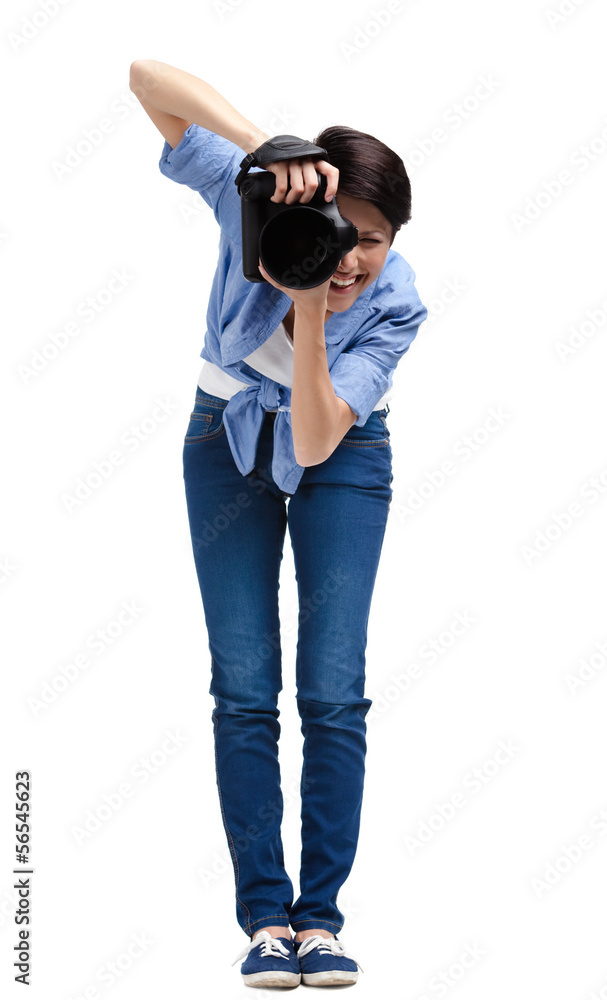 Woman-photographer takes shots, isolated on a white Woman-photographer takes shots, isolated on a white