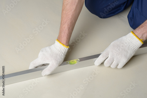 Worker with spirit level photo