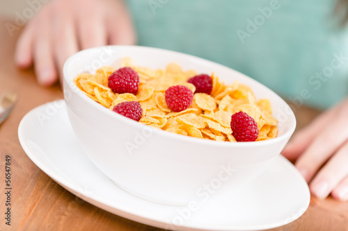 Close up of healthy breakfast: plate with cereals