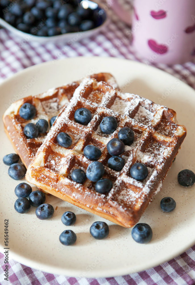 Breakfast with belgian waffles and fresh blueberry Breakfast with belgian waffles and fresh blueberry