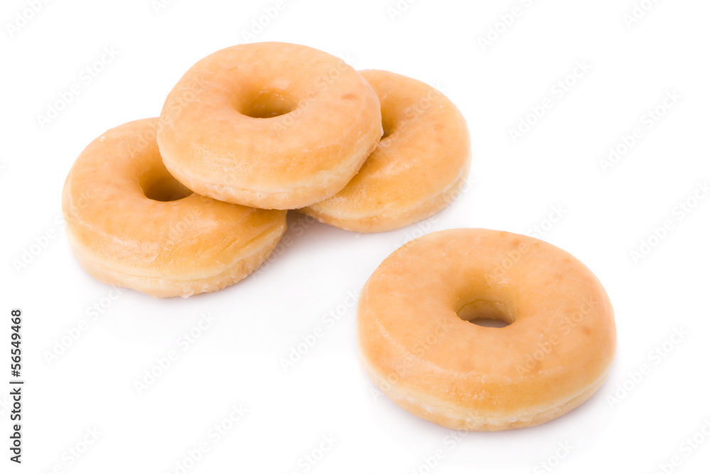 Four doughnuts or donuts piled isolated on white. Four doughnuts or donuts piled isolated on white.