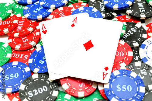 background of poker chips and two aces