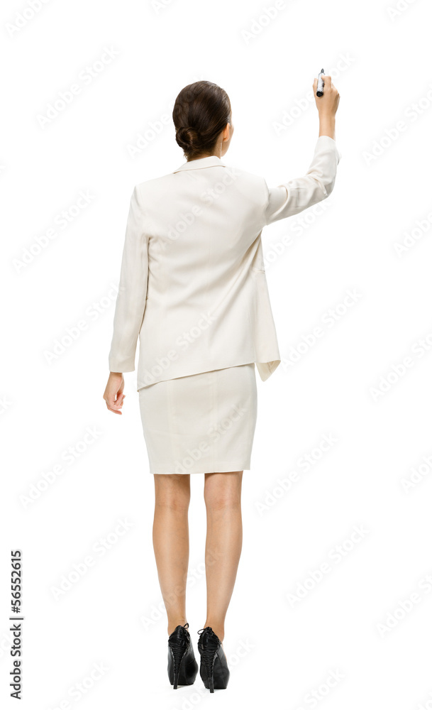 Businesswoman writing on imaginary screen Businesswoman writing on imaginary screen