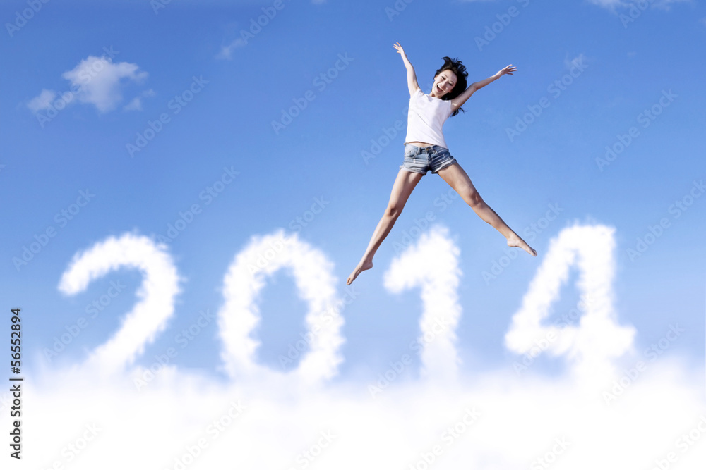 Excited woman jumps with new year 2014 Excited woman jumps with new year 2014