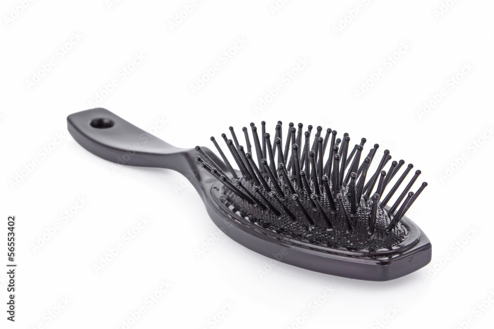 Black hairbrush isolated on a white background. Black hairbrush isolated on a white background.