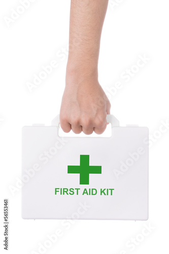 Hand holding a first aid kit isolated on white background. photo