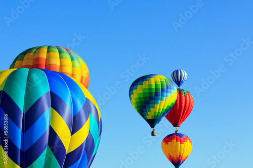hot air balloons against blue sky
