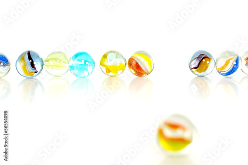 Colourful marbles on white background