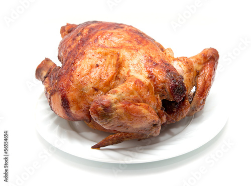 grilled chicken on a plate on a white background photo