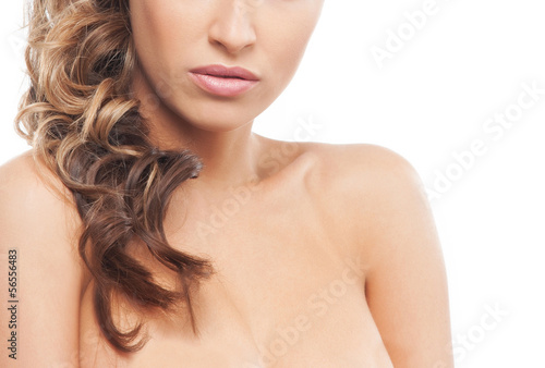 Portrait of a young and beautiful woman on a white background