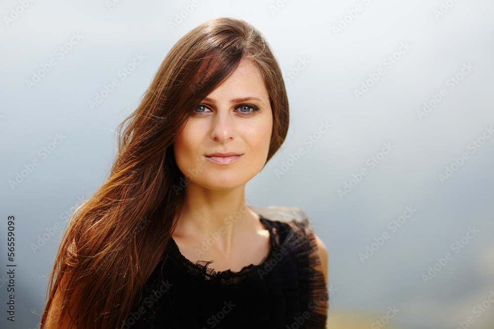 Attractive woman on a mountain landscape