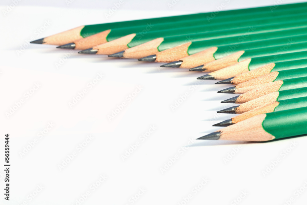 Obraz premium lower view of green pencils on white background