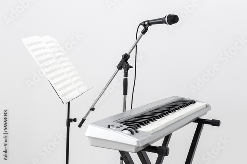 Electric piano, microphone and music stand photo