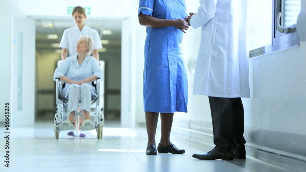 Medical Staff Wheelchair Patient Busy Hospital Facility Medical Staff Wheelchair Patient Busy Hospital Facility