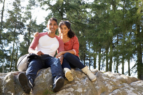 Young Couple Hiking Through Countryside © micromonkey