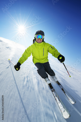 Skier on pise in high mountains