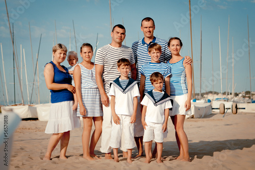 Portrait of happy family near yacht
