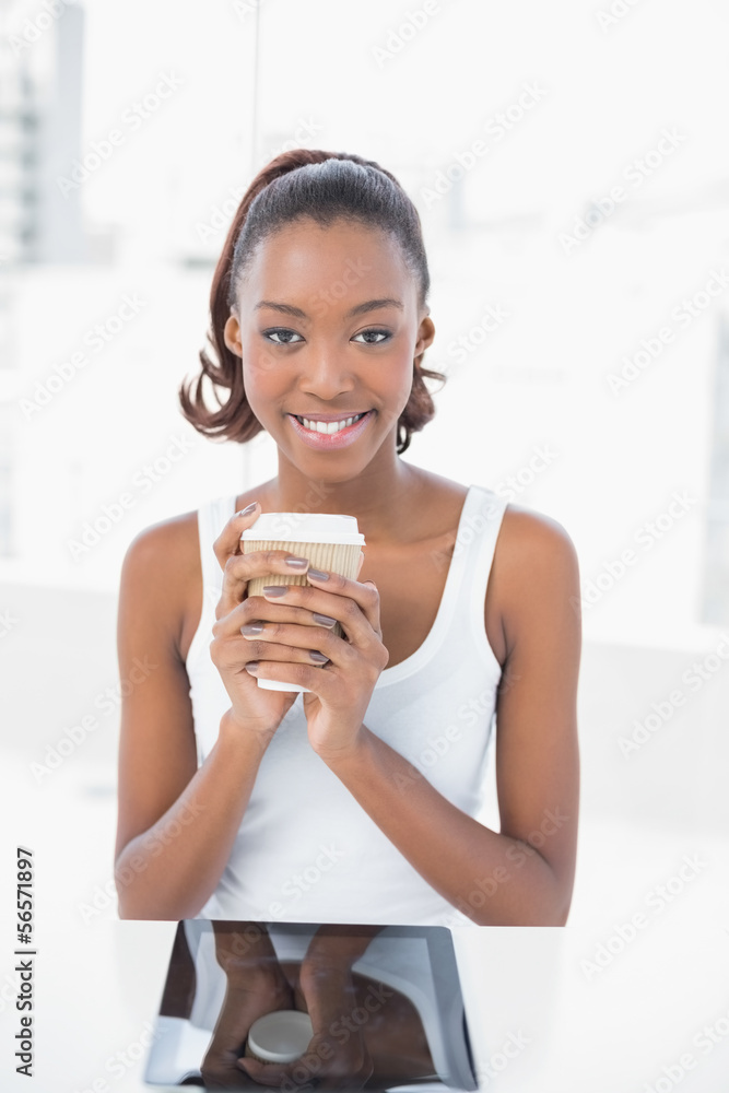 Happy sporty model holding coffee Happy sporty model holding coffee