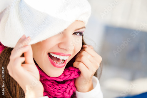 Portrait of smiling woman wearing woolen accessories