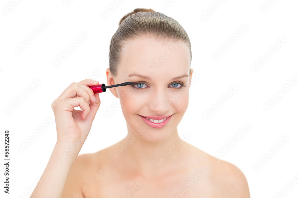 Joyful pretty blonde model applying mascara Joyful pretty blonde model applying mascara