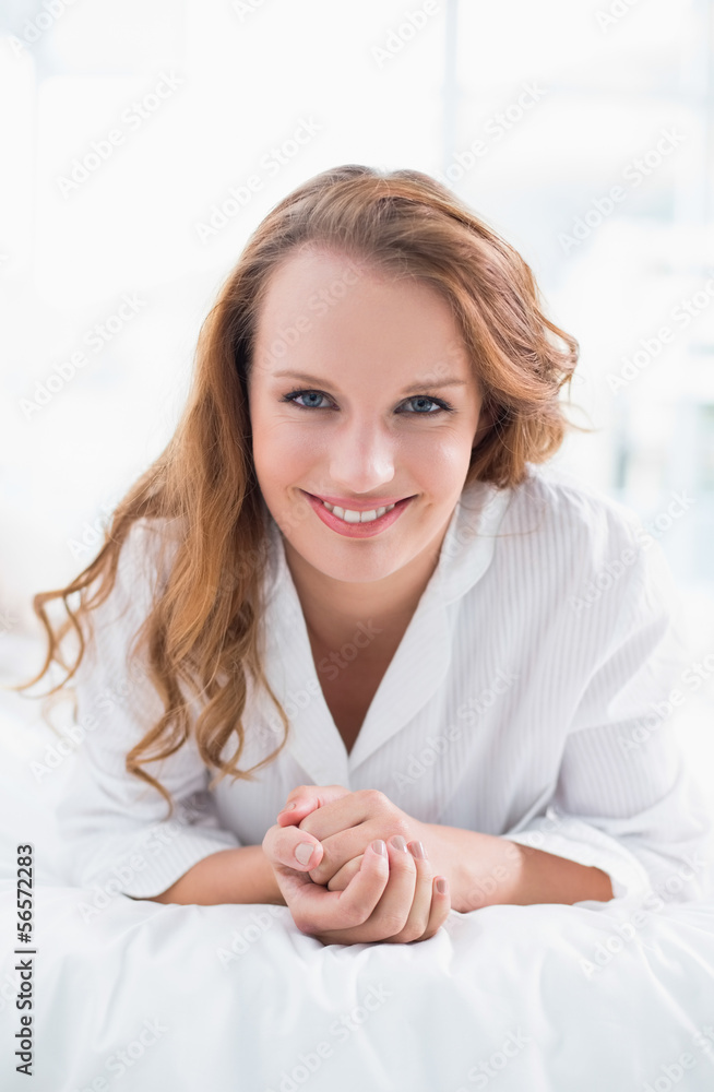 Content pretty woman lying on her bed Content pretty woman lying on her bed