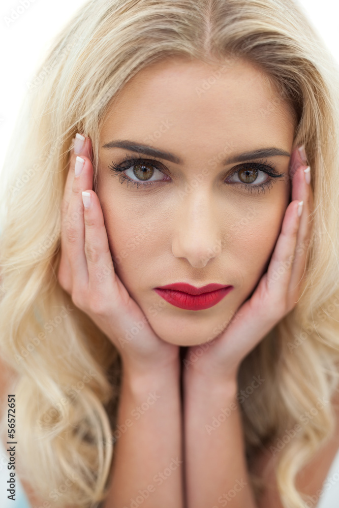 Close up of a stern blonde model looking at camera Close up of a stern blonde model looking at camera